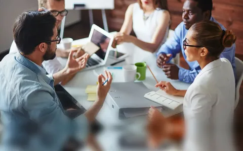 Strategic Procurement & Sourcing A team in a collaborative meeting, utilizing AI&GB's Strategic Procurement & Sourcing, a key part of our Expert Technical and Academic Consulting Services.