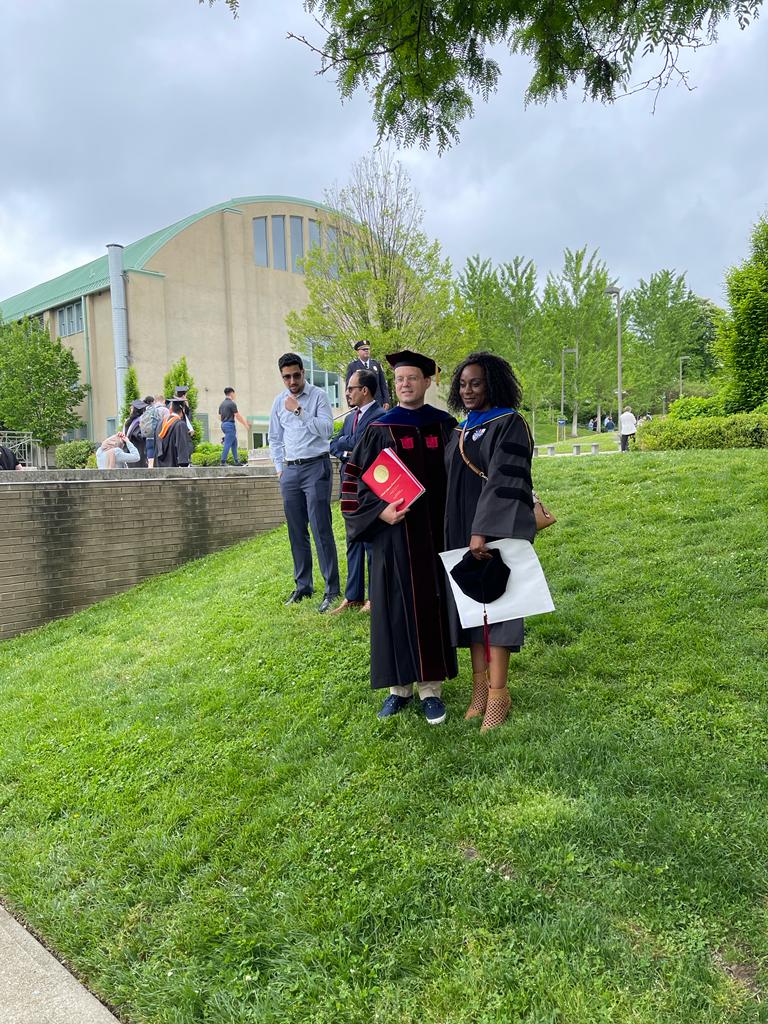 Celebrating the Ph.D. defense and graduation with my mentor, Gunnar Lucko, Ph.D.,F.ASCE.